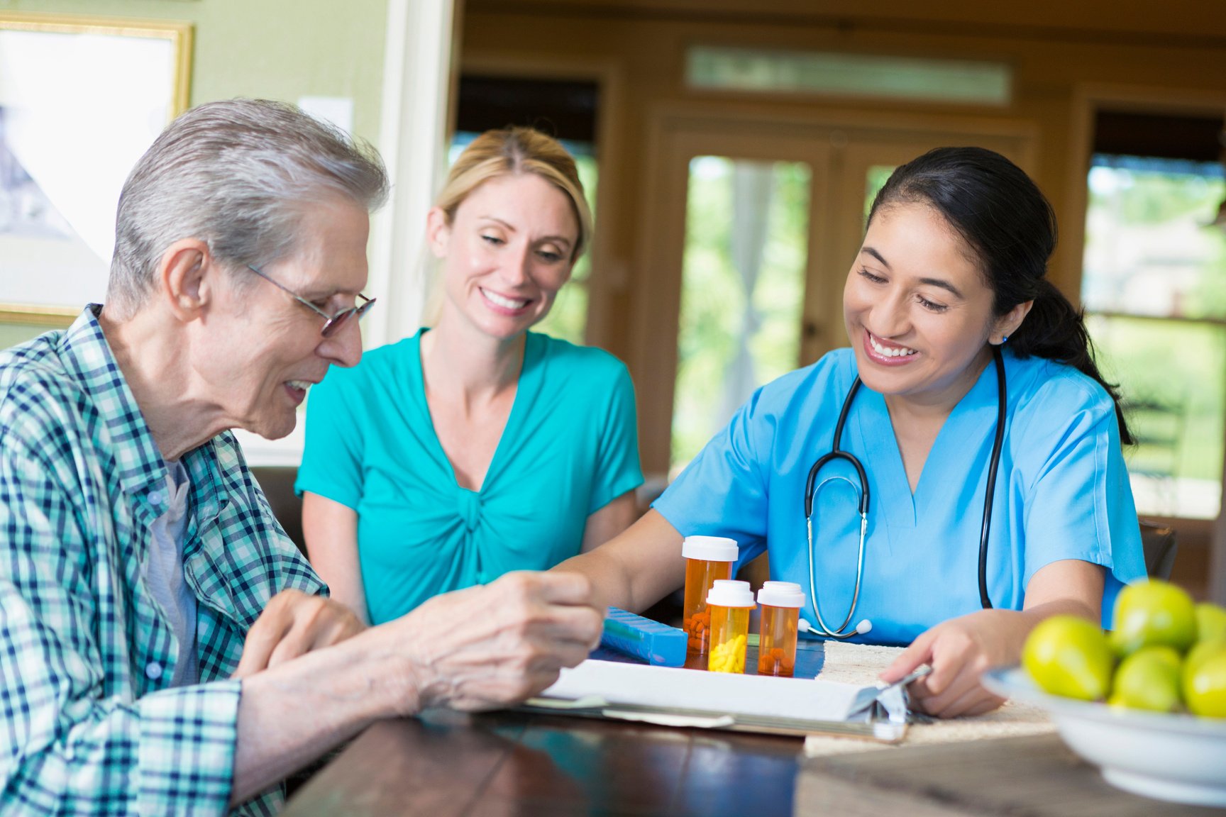 Senior man visits with home health care nurse